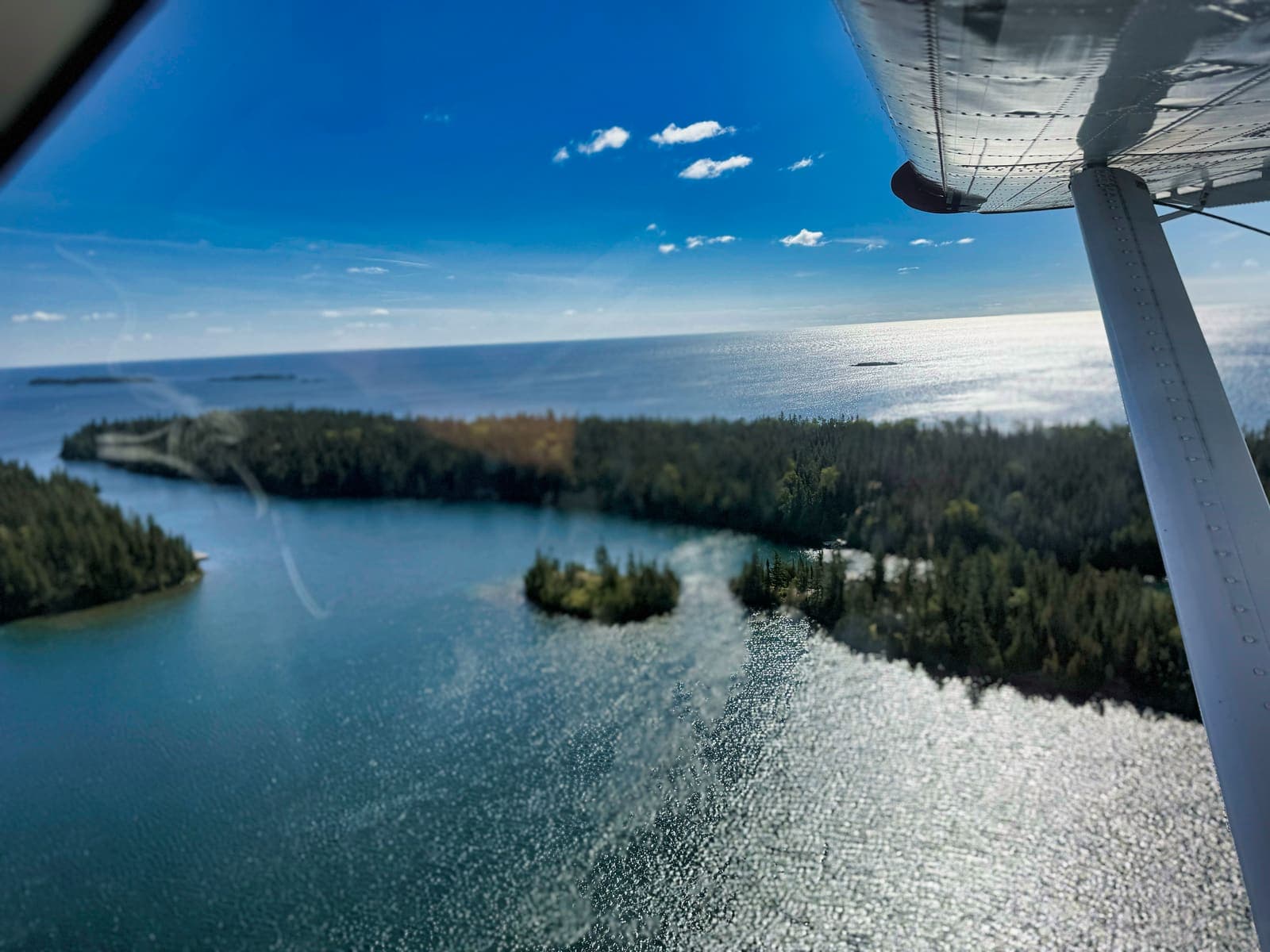 Isle Royale's forested points and islands seen from a floatplane over Lake Superior